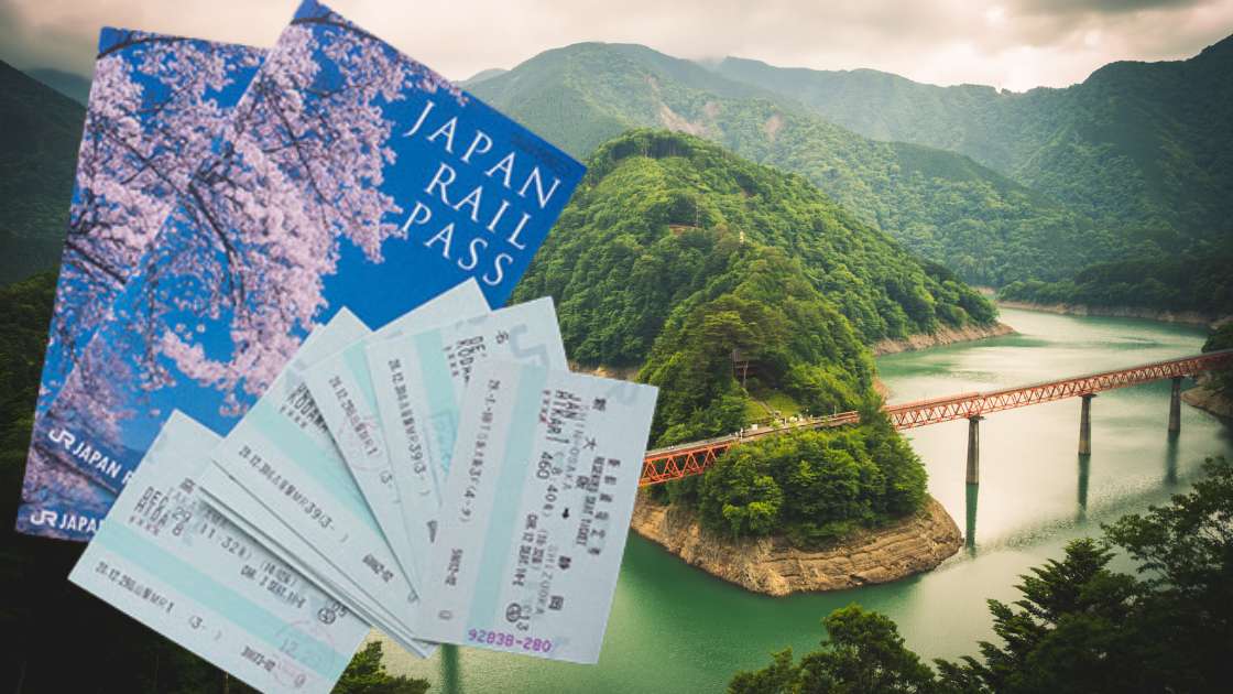 Japanese train tickets in front of a river.