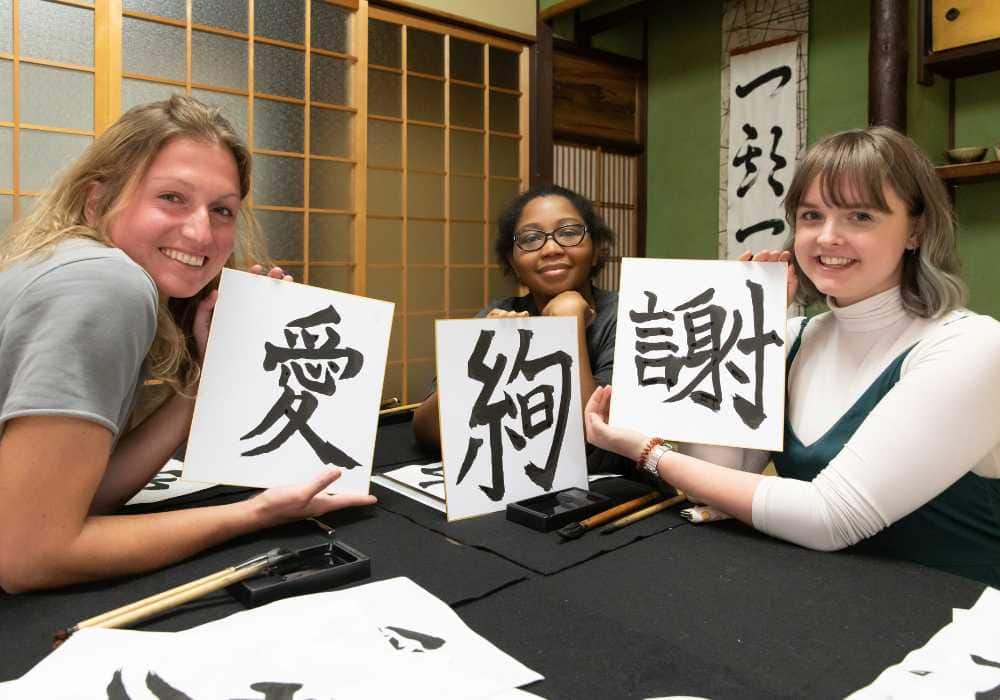A group of women holding signs.