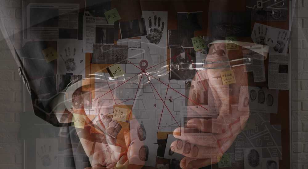 A person in handcuffs is shown in front of a crime investigation board covered with various documents, photographs, and red strings connecting points of interest.