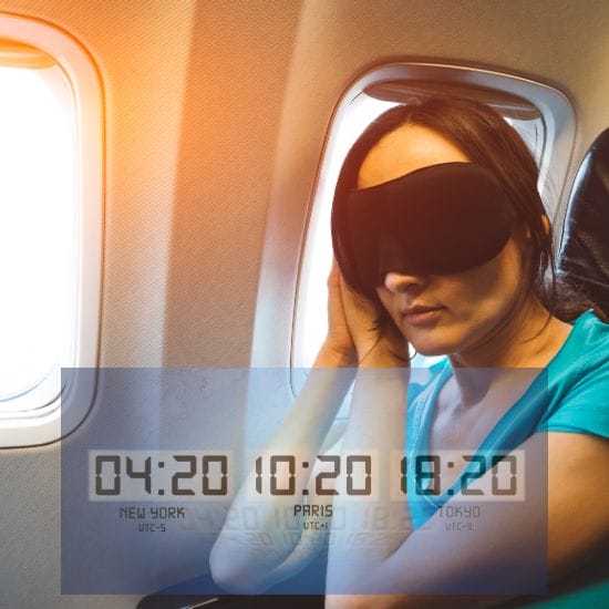 A person wearing a sleep mask sits by the window on an airplane. Overlaid text shows times for New York, Paris, and Tokyo: 04:20, 10:20, and 18:20 respectively.