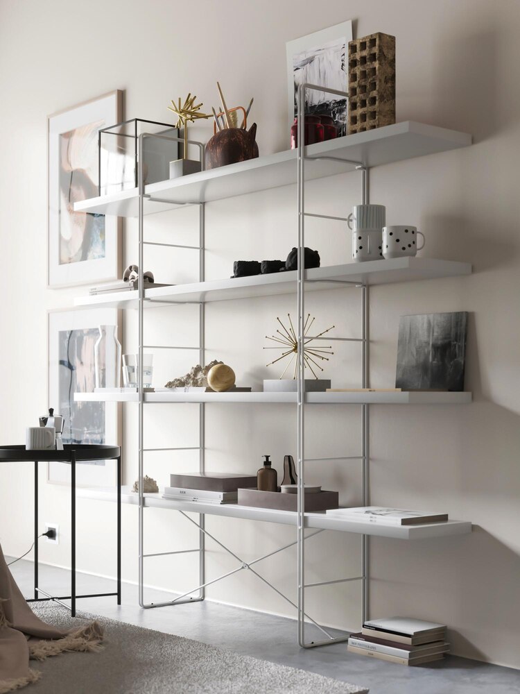 Open drawers and baskets show storage items organized into separate compartments, illustrating a tip about dividing storage like a bento box for neatness and efficiency.